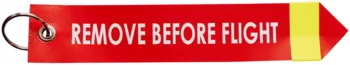 Tiras de ad­ver­ten­cia con inscripción "Quitar Antes del Vuelo", con reflector